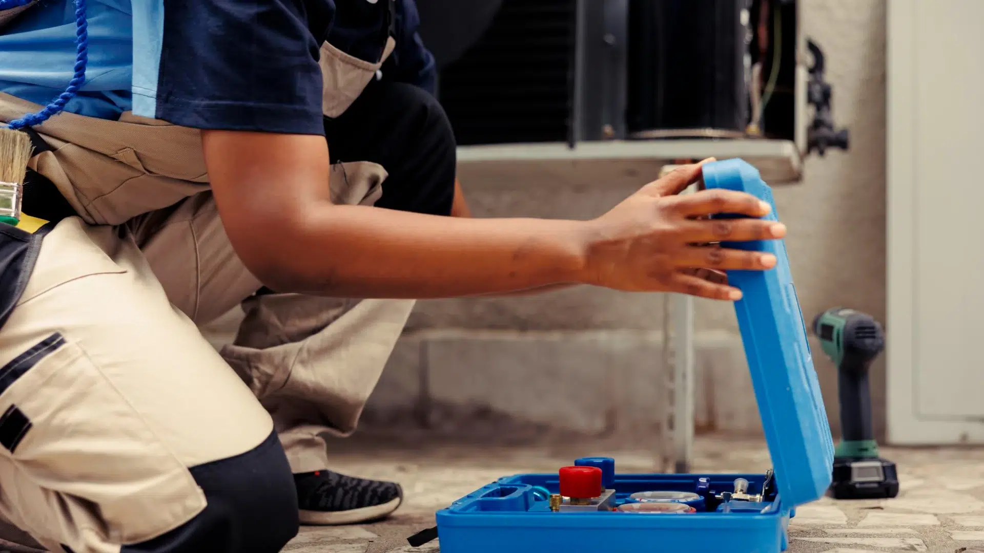 Technician opening blue tool case